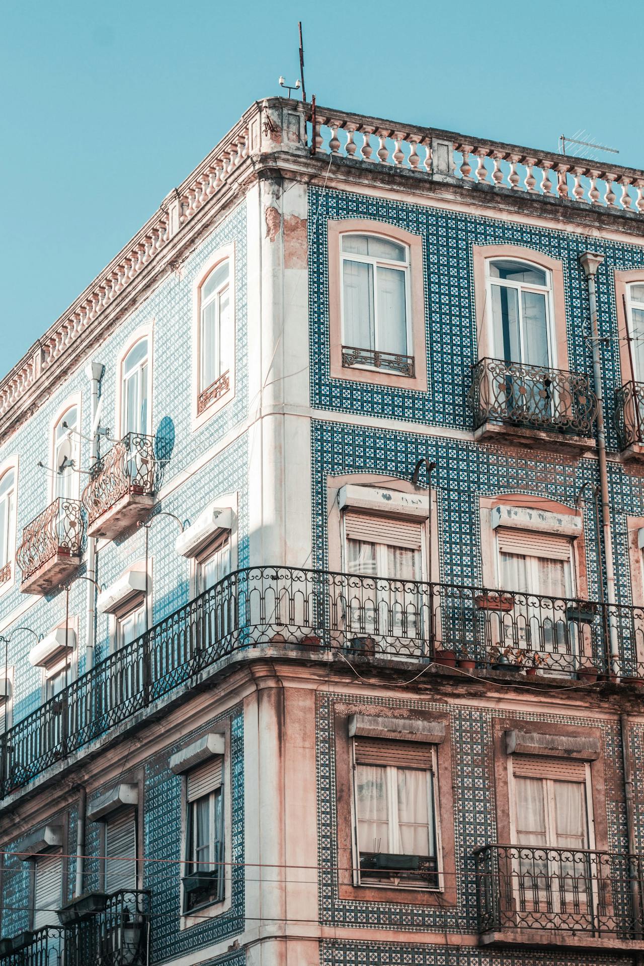 Lisbon apartment block with blue tiles on a blue sky background
